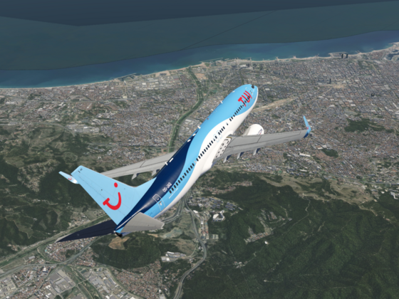 TUI Boeing 737-800 above Barcelona